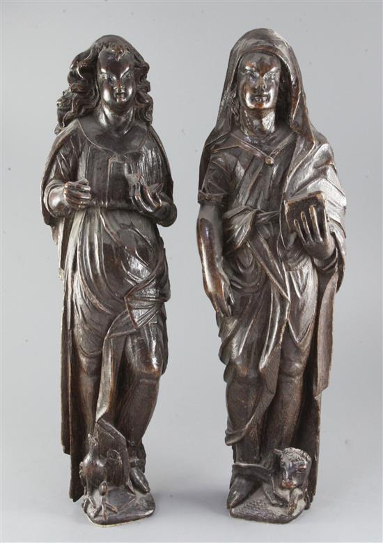 A pair of 16th century Flemish / Dutch carved oak evangelists, each 21.5in.